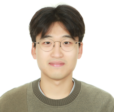 A person smiling in front of a white buildingAI-generated content may be incorrect.